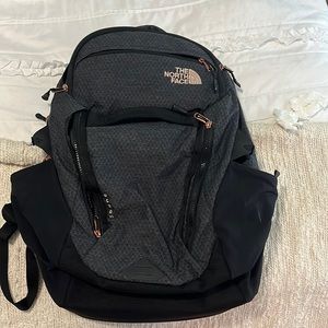 North face charcoal grey and rose gold backpack